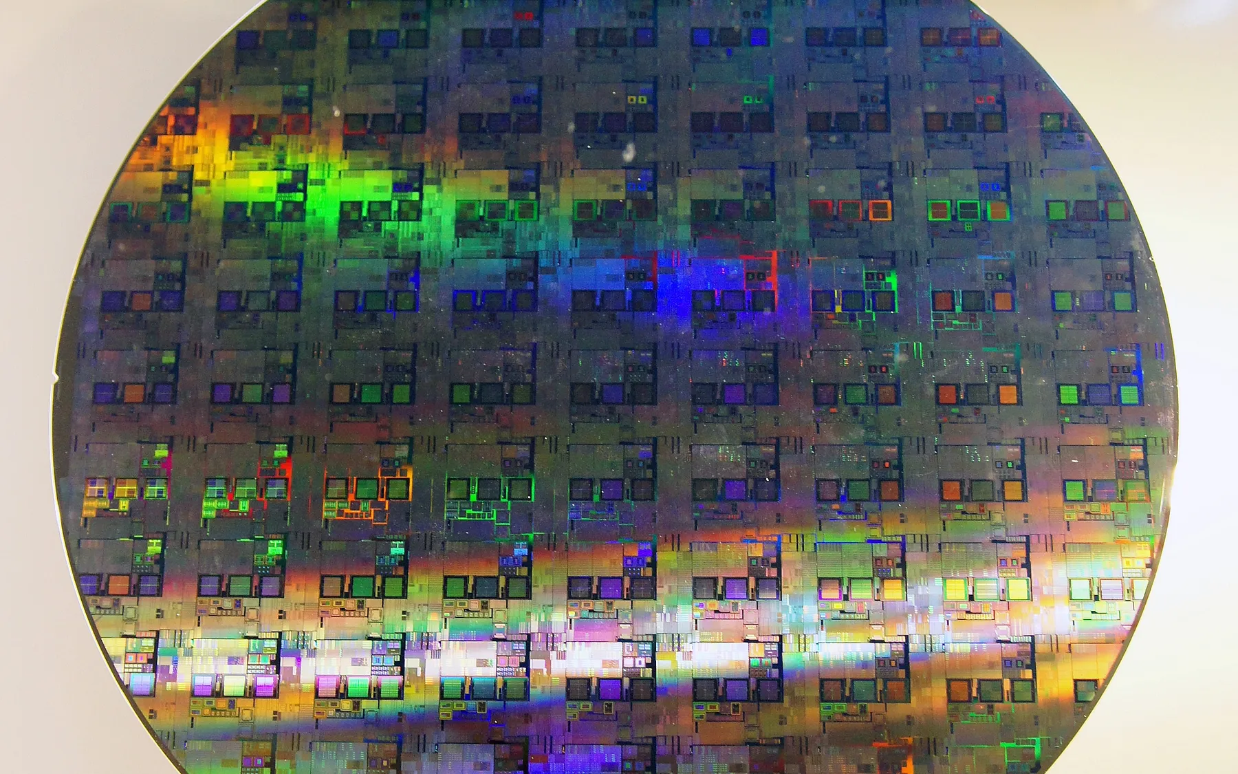 A 12-inch silicon wafer patterned with chips.