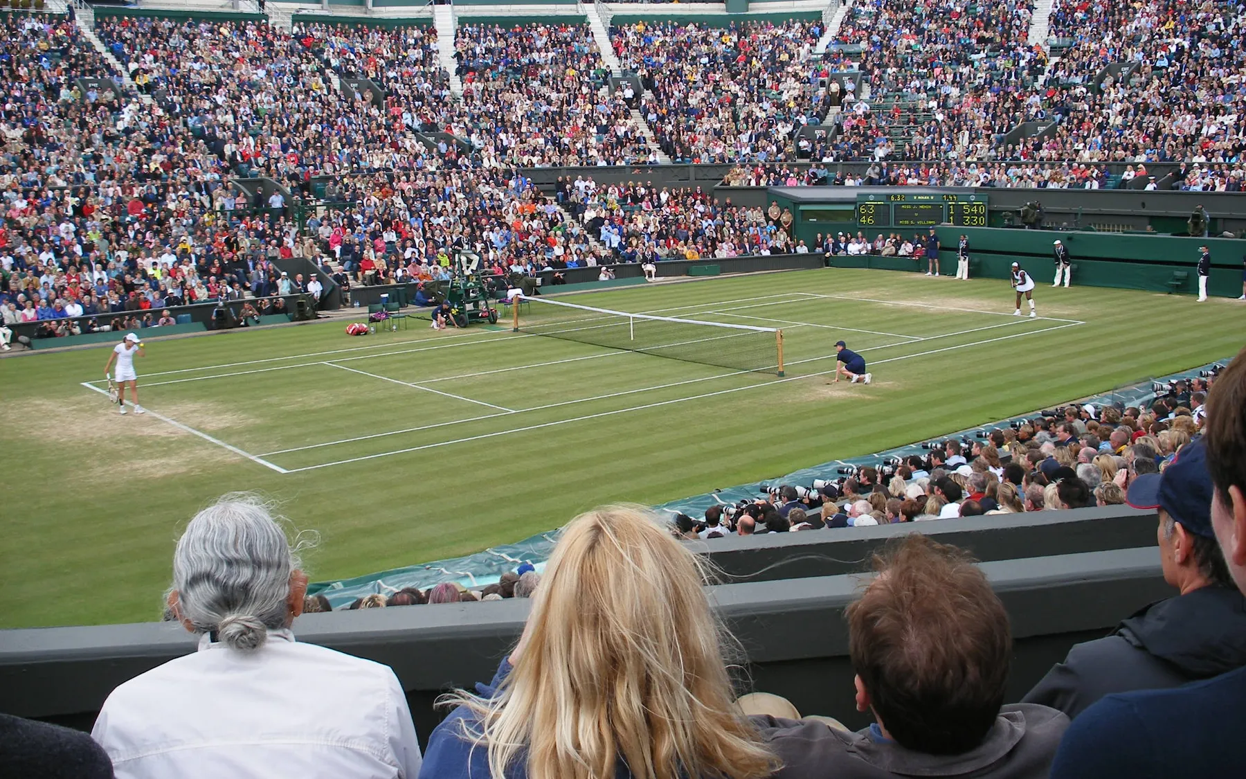 Spectators watching a match on Centre Court at Wimbledon