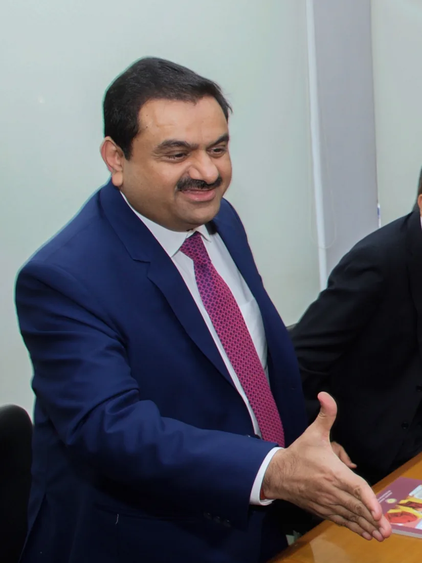 Gautam Adani reaching to shake hands at a meeting in Gandhinagar.