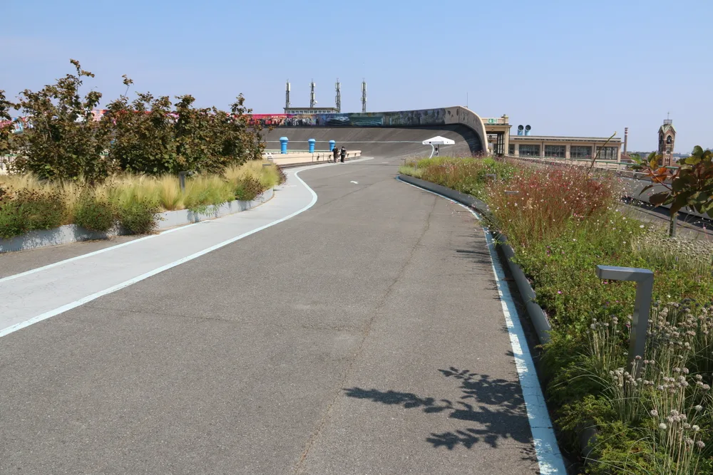 The banked rooftop test track of the former Fiat factory at Lingotto, now lined with planted beds and a footpath.