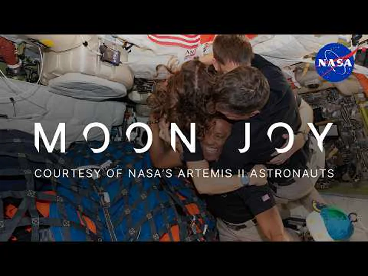 The Artemis II crew floating inside the Orion spacecraft.